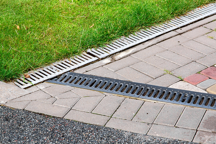 a walkway with side drain